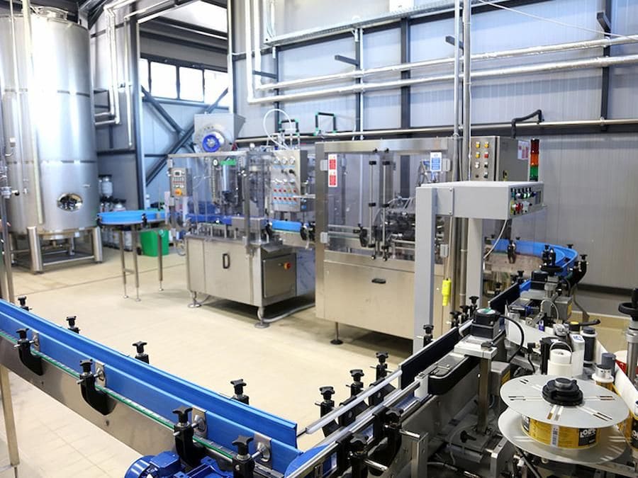 view from above of packaging beer machines at Pineios Brewery plant-Gastronomy Tours